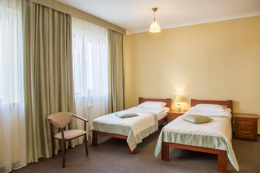 Postel nebo postele na pokoji v ubytování Hotel Patriarshyi