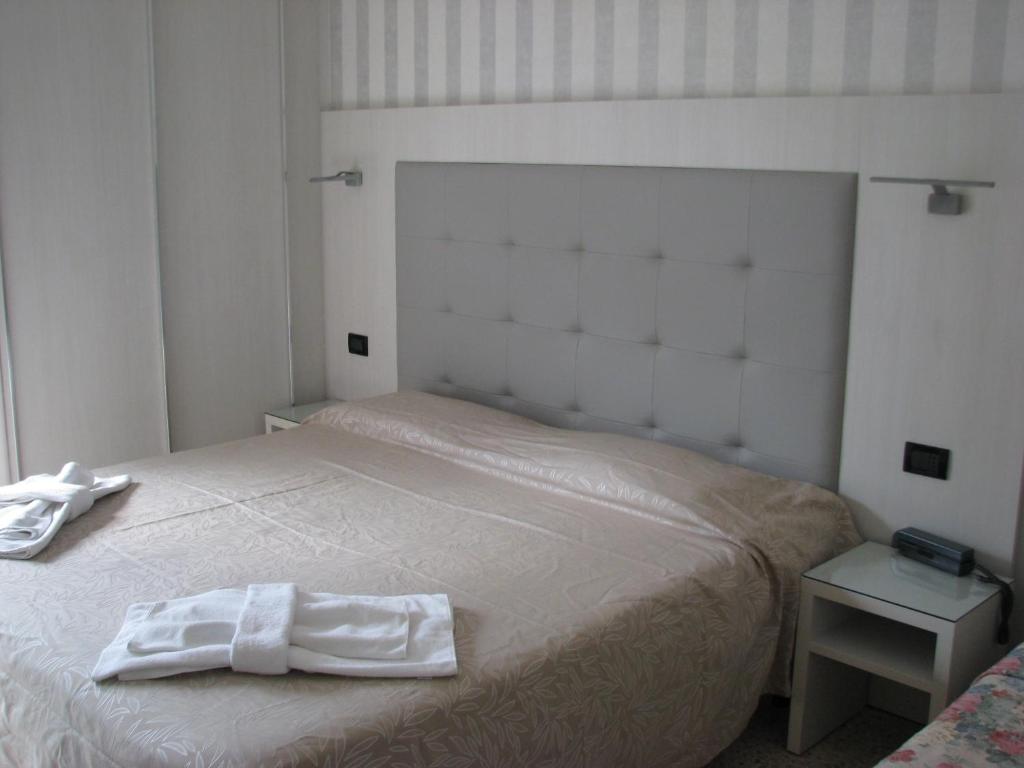 Postel nebo postele na pokoji v ubytování Hotel Fabius