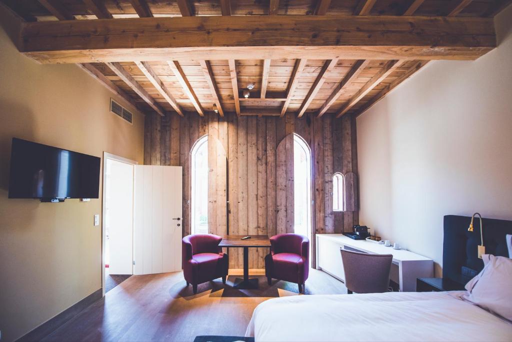 Postel nebo postele na pokoji v ubytování B&B Huize Briers