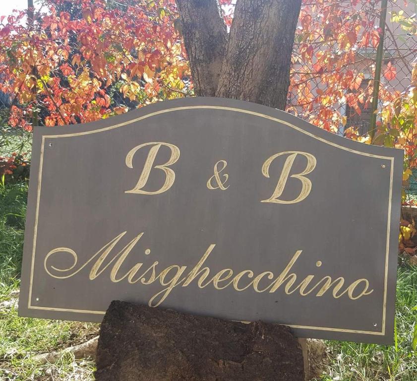 a sign that reads b b mischebiology at Bed and Breakfast Misghecchino in Foligno