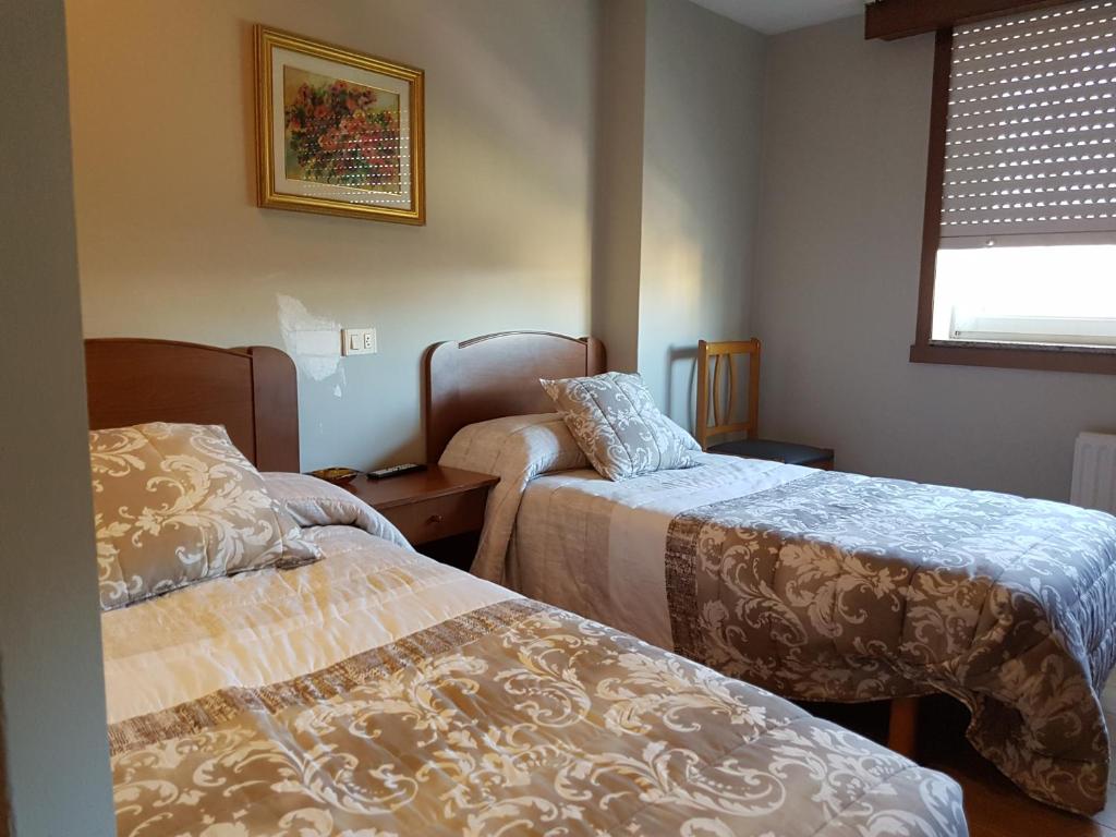 Posteľ alebo postele v izbe v ubytovaní Hostal Galicia Arteixo