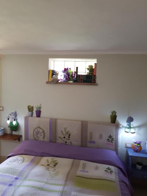 Postel nebo postele na pokoji v ubytování casa di campagna dal pozzo