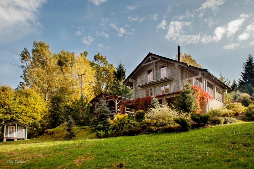 a house on top of a hill with trees at Srub Bublava 806 in Bublava