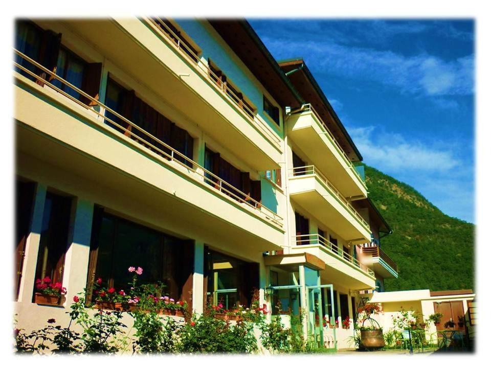 a building with flowers on the balconies of it at La Darentasia in La Léchère