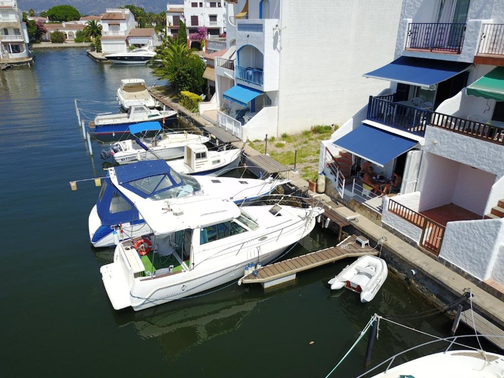 a group of boats are docked at a dock at Port Empuries in Empuriabrava