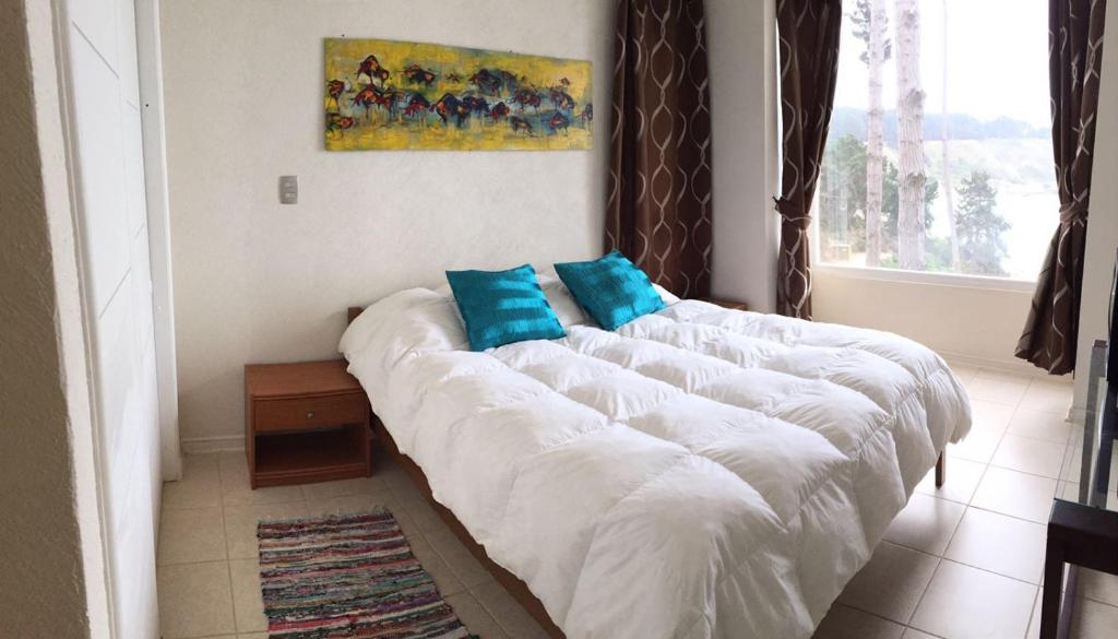 Postel nebo postele na pokoji v ubytování Departamento en la Playa