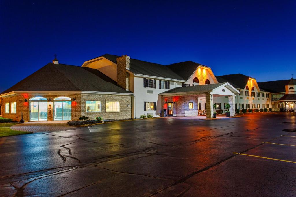 an empty parking lot in front of a building at Hotel J Green Bay in Green Bay