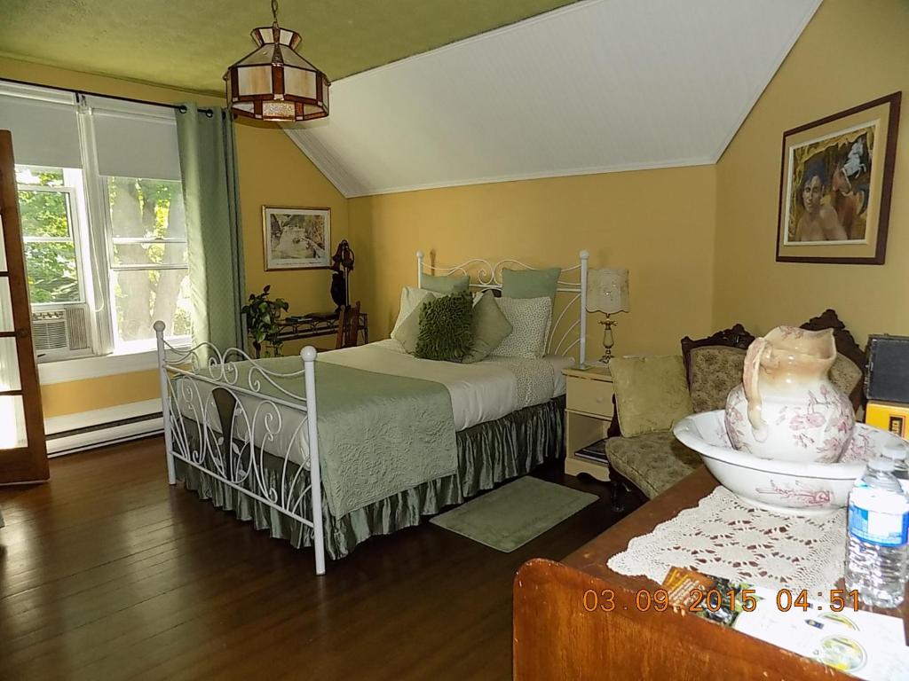Postel nebo postele na pokoji v ubytování À L'Ancestrale B&B