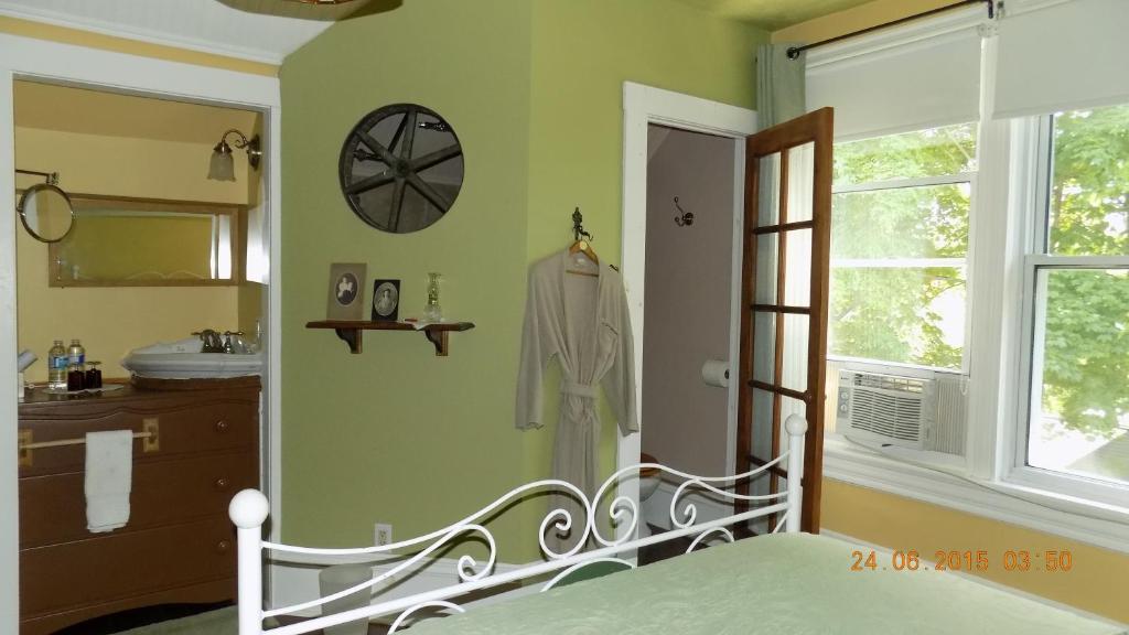 Postel nebo postele na pokoji v ubytování À L'Ancestrale B&B