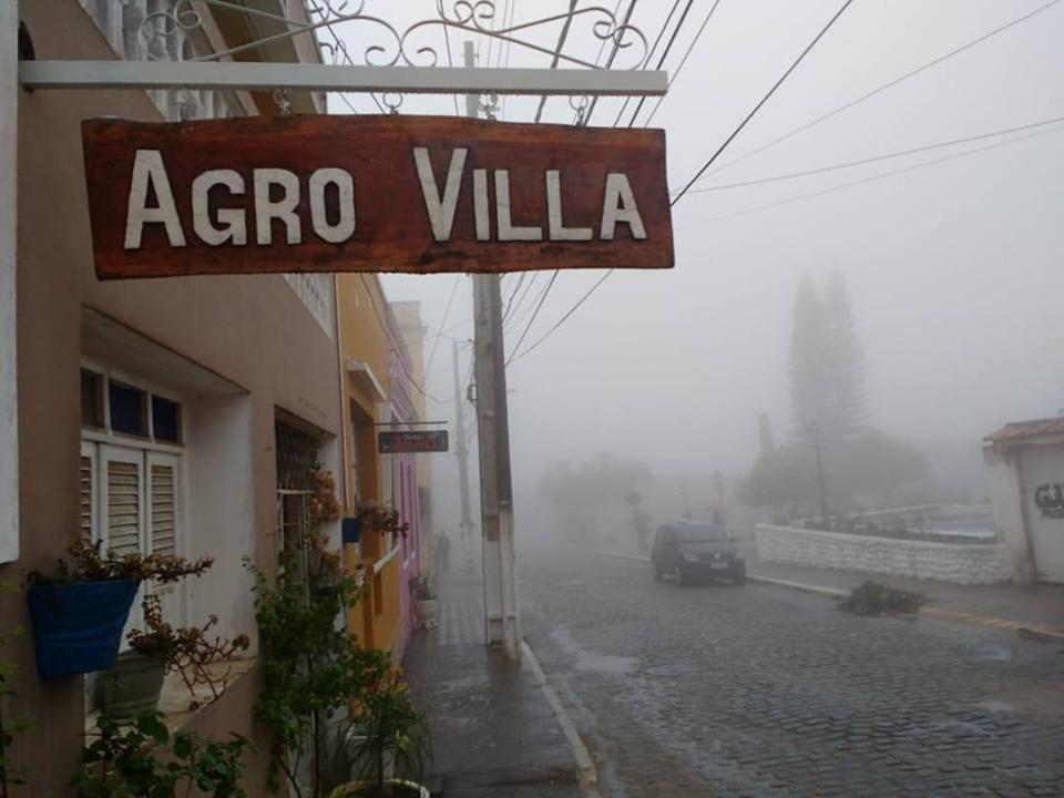 a sign for a argo villa on a street at Agro Villa in Areia