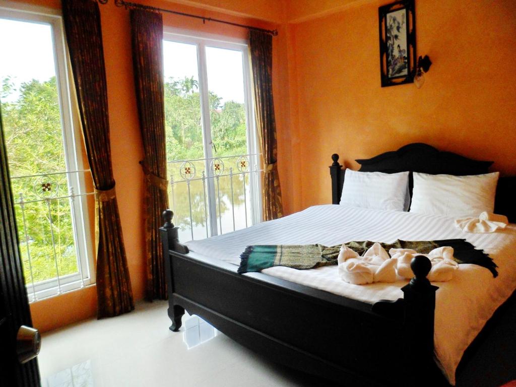 Кровать или кровати в номере Khaolak Boutique Hertitage