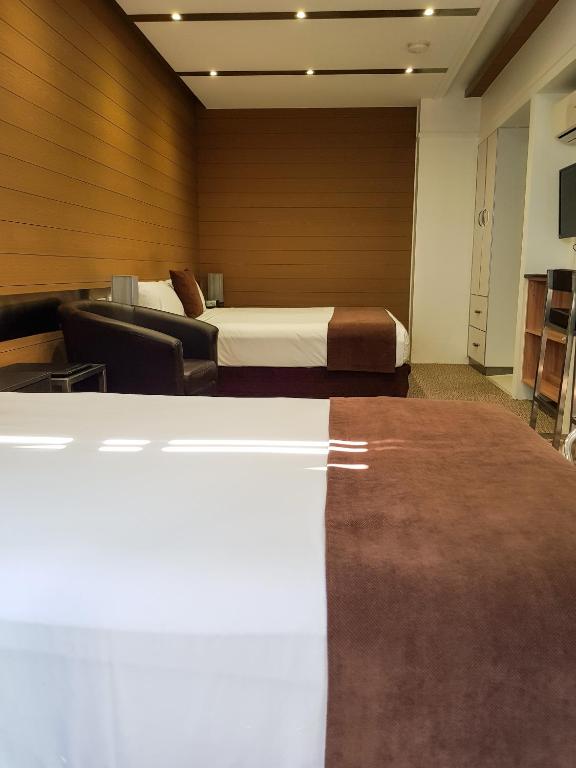 TV a/nebo společenská místnost v ubytování Moura Meridian Motel