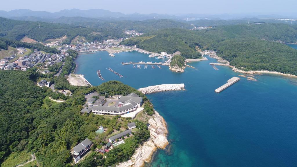 an aerial view of a house on a island in the water at Tsushima Grand Hotel in Tsushima