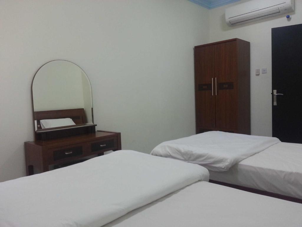 Postel nebo postele na pokoji v ubytování Paradise Inn Hotel (Tabasum Group)