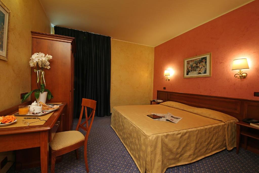 A bed or beds in a room at Hotel Abacus