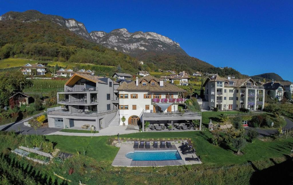 an aerial view of a house with a pool at Residence Prunarhof in Caldaro