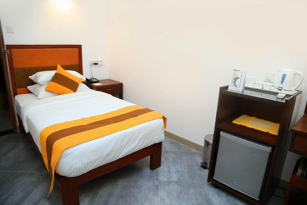 Postel nebo postele na pokoji v ubytování Spring Villas Kandy