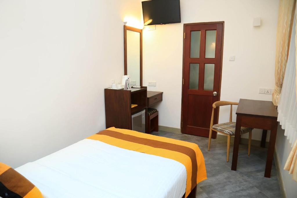 Postel nebo postele na pokoji v ubytování Spring Villas Kandy