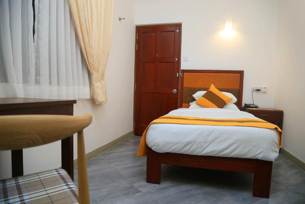 Postel nebo postele na pokoji v ubytování Spring Villas Kandy