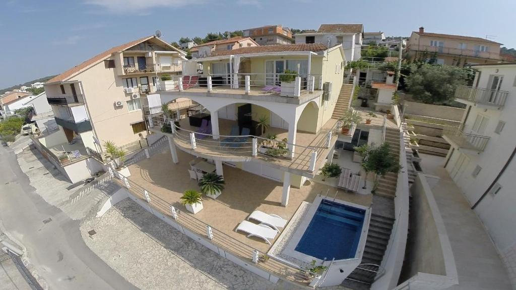 an aerial view of a house with a swimming pool at Palace View in Trogir