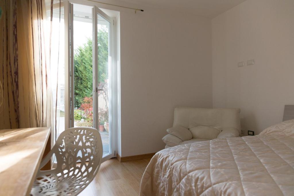 A bed or beds in a room at Guest House Le Acacie