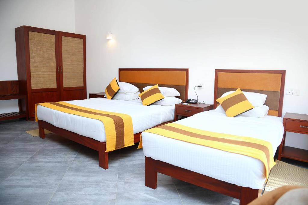 Postel nebo postele na pokoji v ubytování Spring Villas Kandy