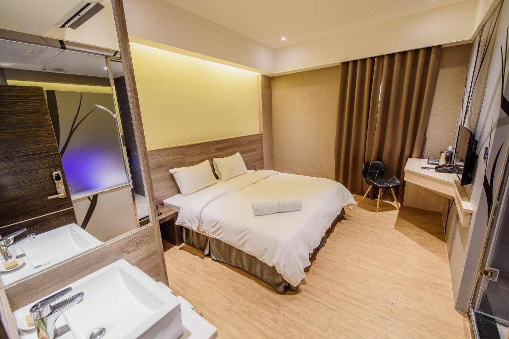 Postel nebo postele na pokoji v ubytování SIX FUKUN HOTEL