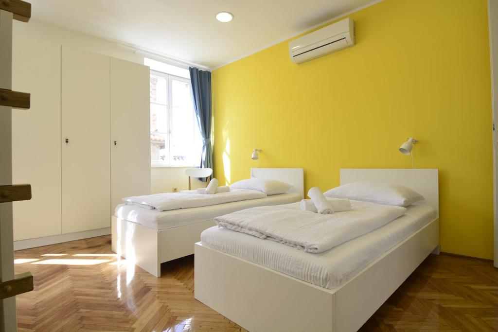 Postel nebo postele na pokoji v ubytování Hostel Sv. Lovre