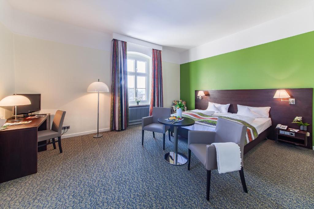 Postel nebo postele na pokoji v ubytování relexa hotel Bad Steben GmbH