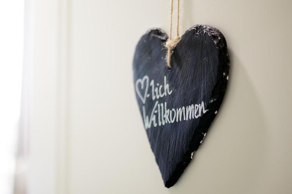 a black heart ornament hanging on a wall at relexa hotel Bad Steben GmbH in Bad Steben