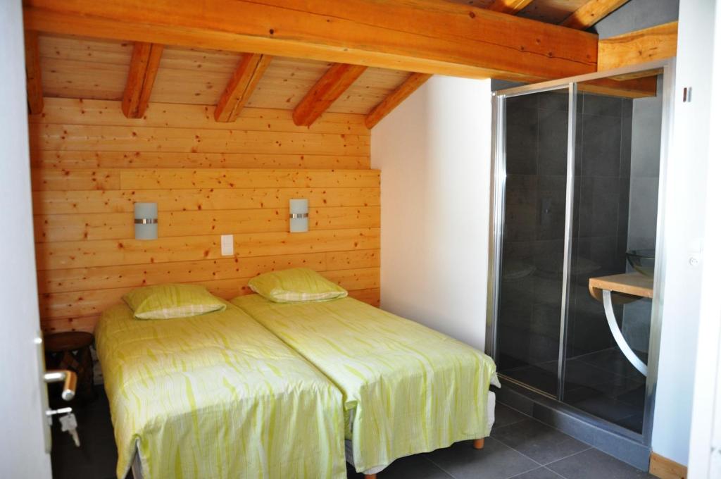 Cama ou camas em um quarto em Chalet D&#39; Edmond