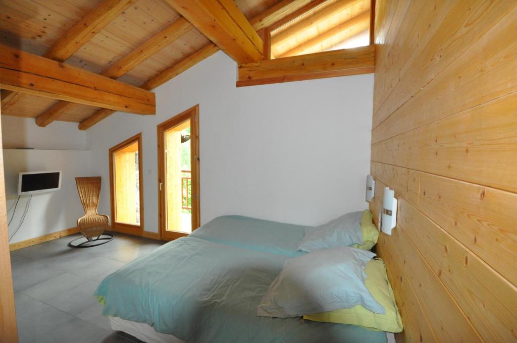 Cama ou camas em um quarto em Chalet D&#39; Edmond