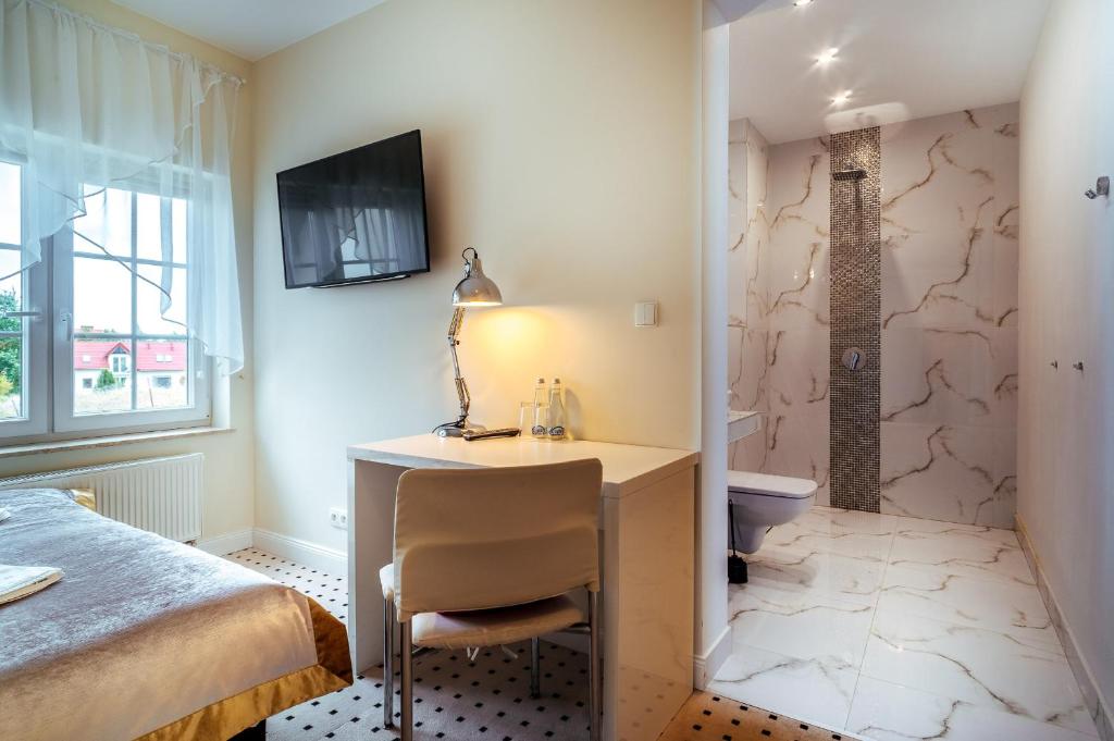 Posteľ alebo postele v izbe v ubytovaní Apartamenty M&M