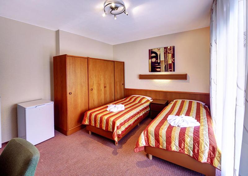 Postel nebo postele na pokoji v ubytování Hotel Kallmeyer