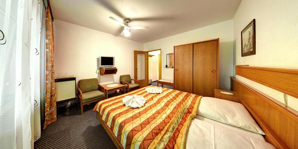 Postel nebo postele na pokoji v ubytování Hotel Kallmeyer
