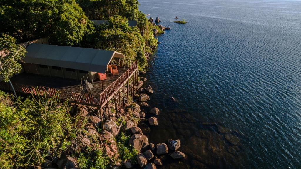 an aerial view of a building next to the water at Wag Hill Lodge & Spa in Mwanza