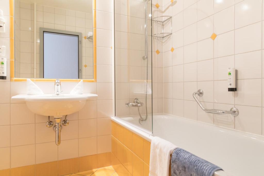 Koupelna v ubytování Hôtel Des Arts