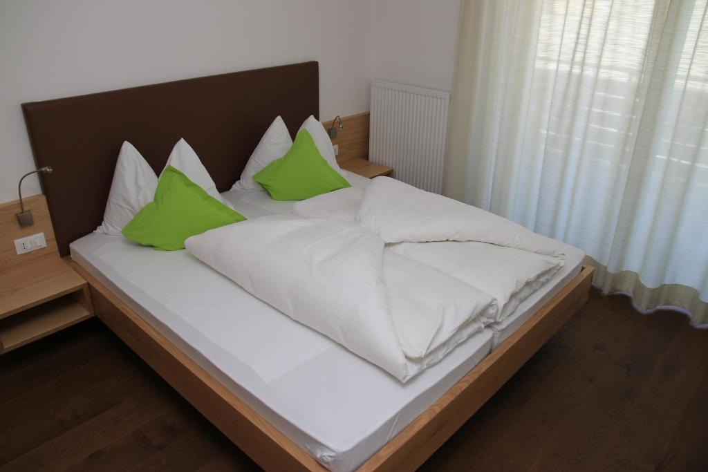 Postel nebo postele na pokoji v ubytování Garni Raffein