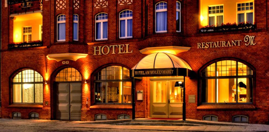 a brick building with a hotel in front of it at Hotel am Molkenmarkt in Brandenburg an der Havel