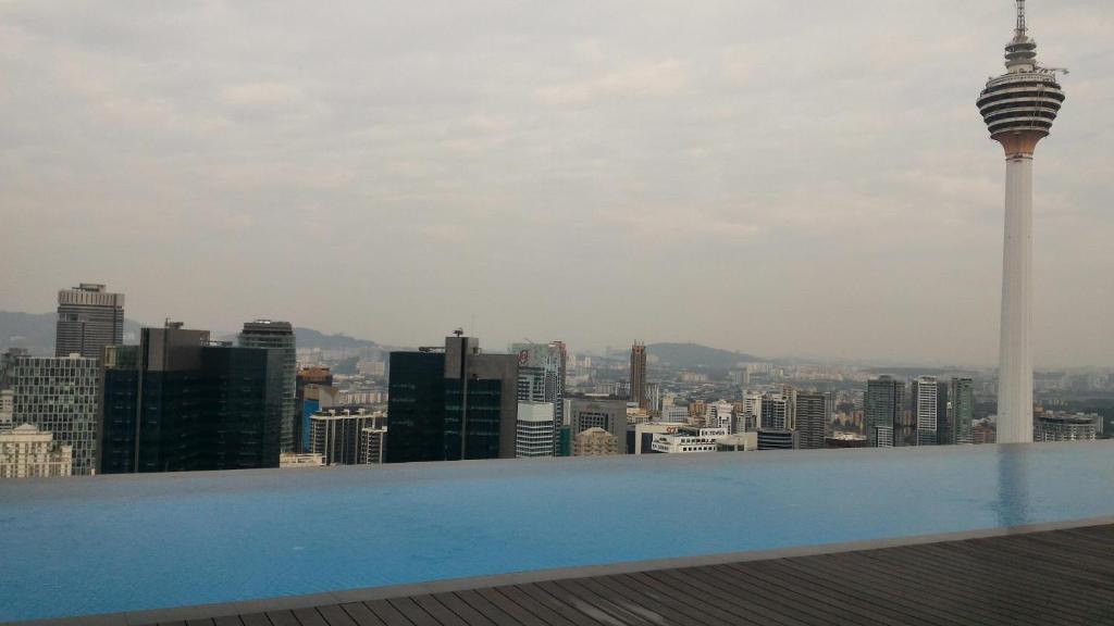 a swimming pool with a view of the city at Platinum KLCC Serviced Suites in Kuala Lumpur