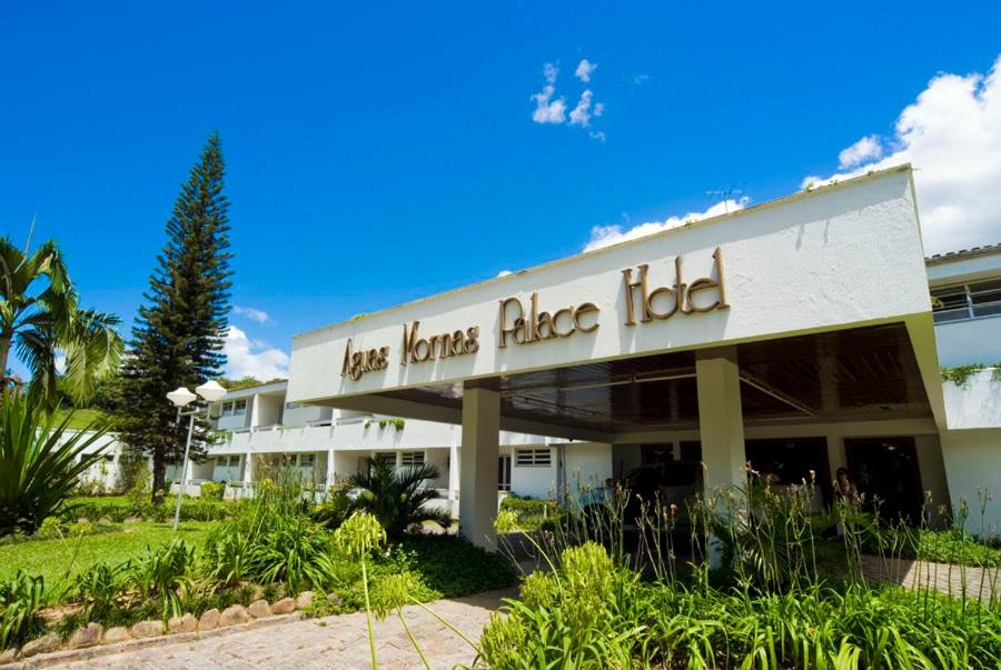 a building with a sign for the hoskins ridge hotel at Aguas Mornas Palace Hotel in Santo Amaro da Imperatriz