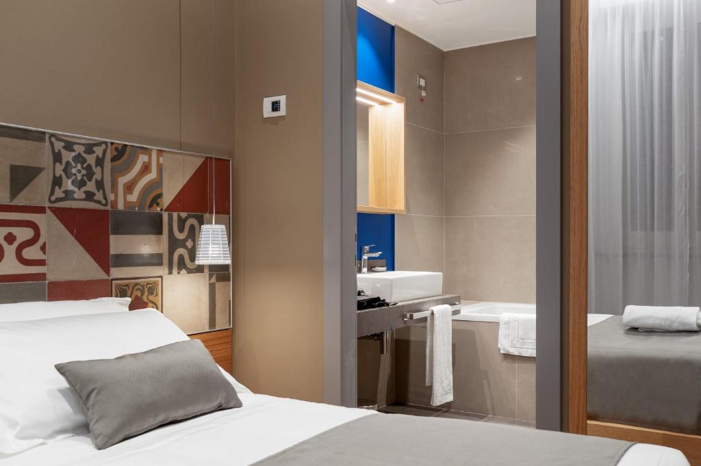 Postel nebo postele na pokoji v ubytování Hotel Medinblu