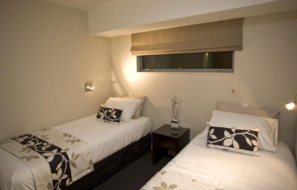 Postel nebo postele na pokoji v ubytování Focus Motel