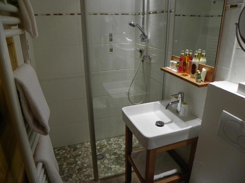 a bathroom with a shower and a sink at Carlina in La Clusaz