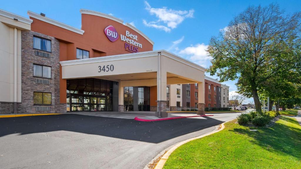 a hotel building with a sign on the front of it at Best Western Plus Dakota Ridge in Eagan