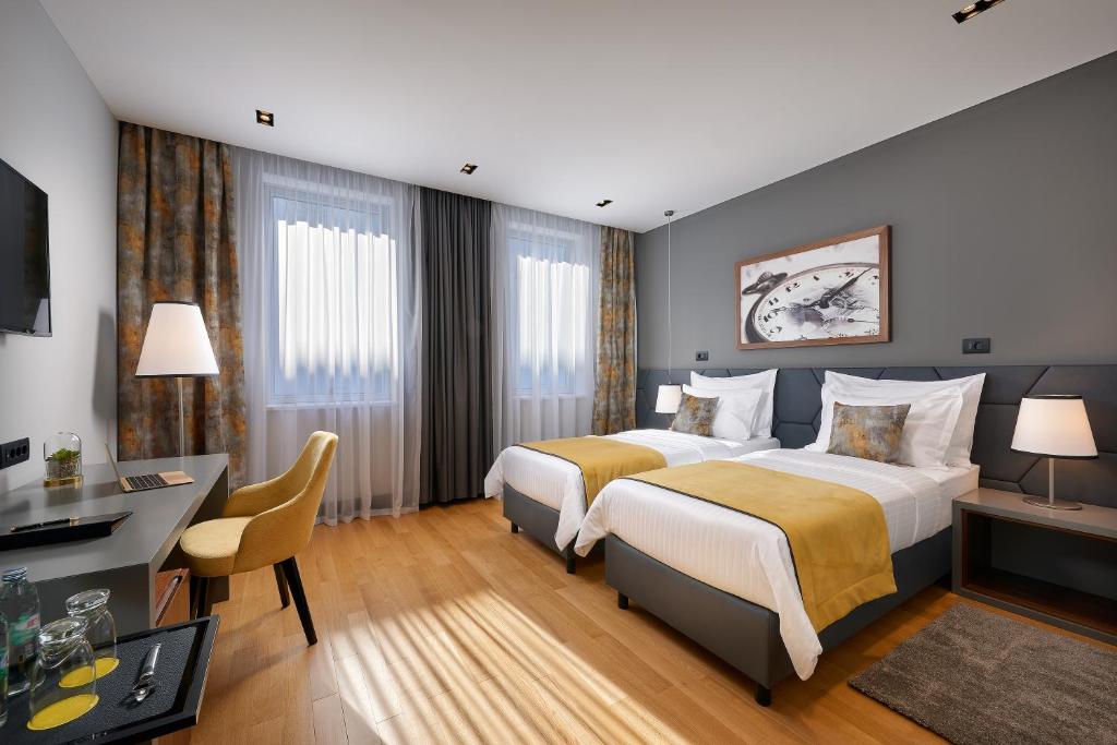 Posteľ alebo postele v izbe v ubytovaní Sia Split Hotel