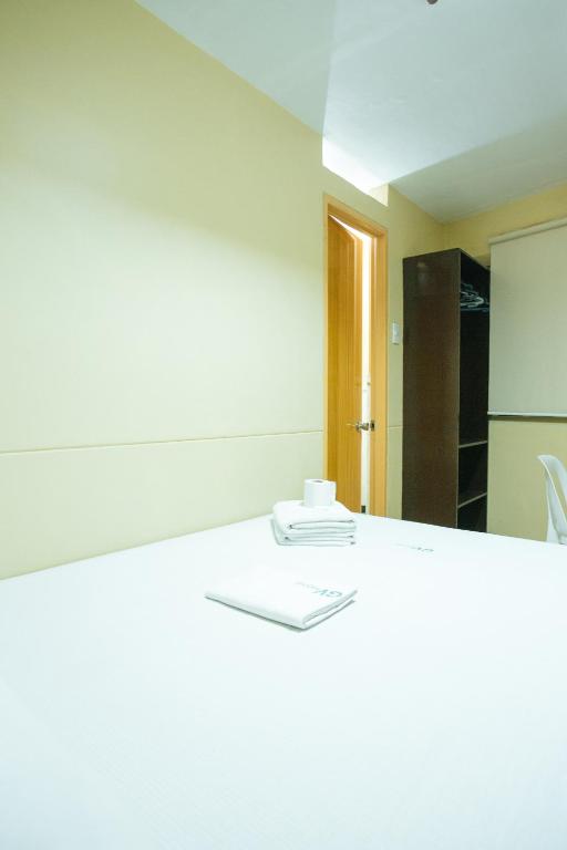 Postel nebo postele na pokoji v ubytování GV Hotel - Talisay City