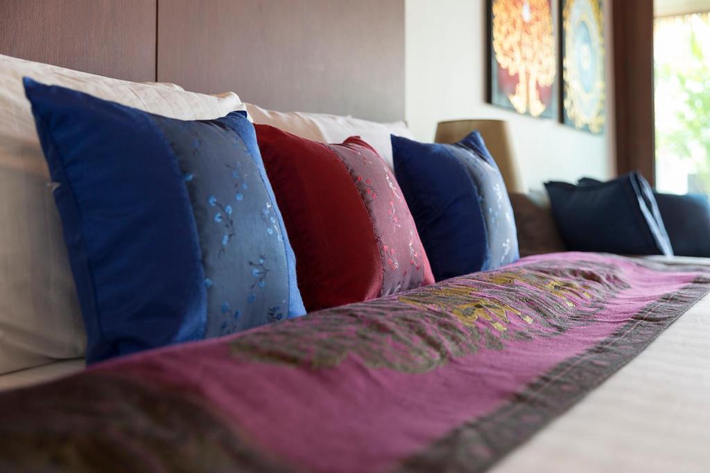 Ein Bett oder Betten in einem Zimmer der Unterkunft Mali Resort Sunrise Beach