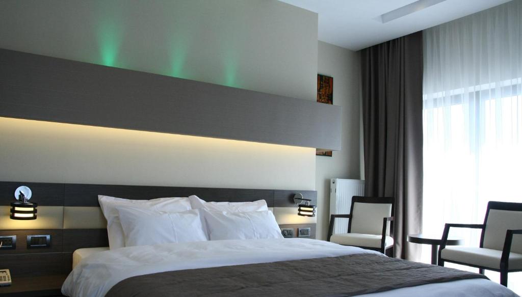 Postel nebo postele na pokoji v ubytování Hotel Scapino