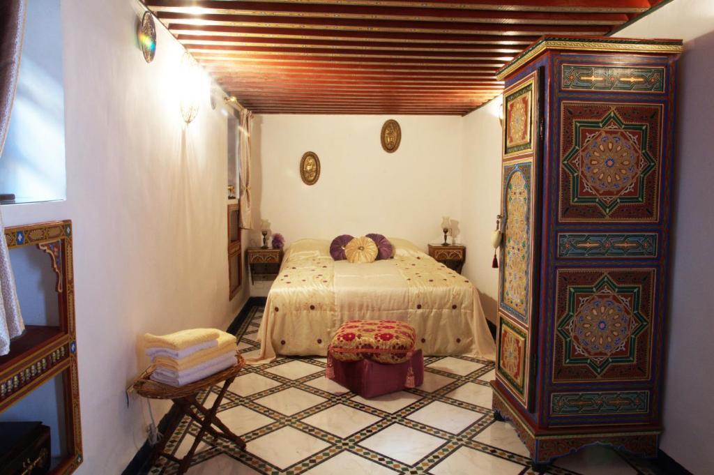 a bedroom with a bed in a room at Riad Fes Kettani in Fez
